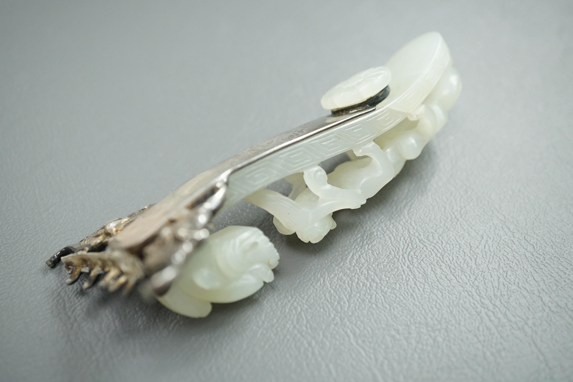 A Chinese jade and cabochon mounted hand mirror, the jade 18th/19th century